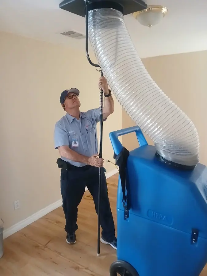 HVAC Installation technician using HEPA equipment in Alice